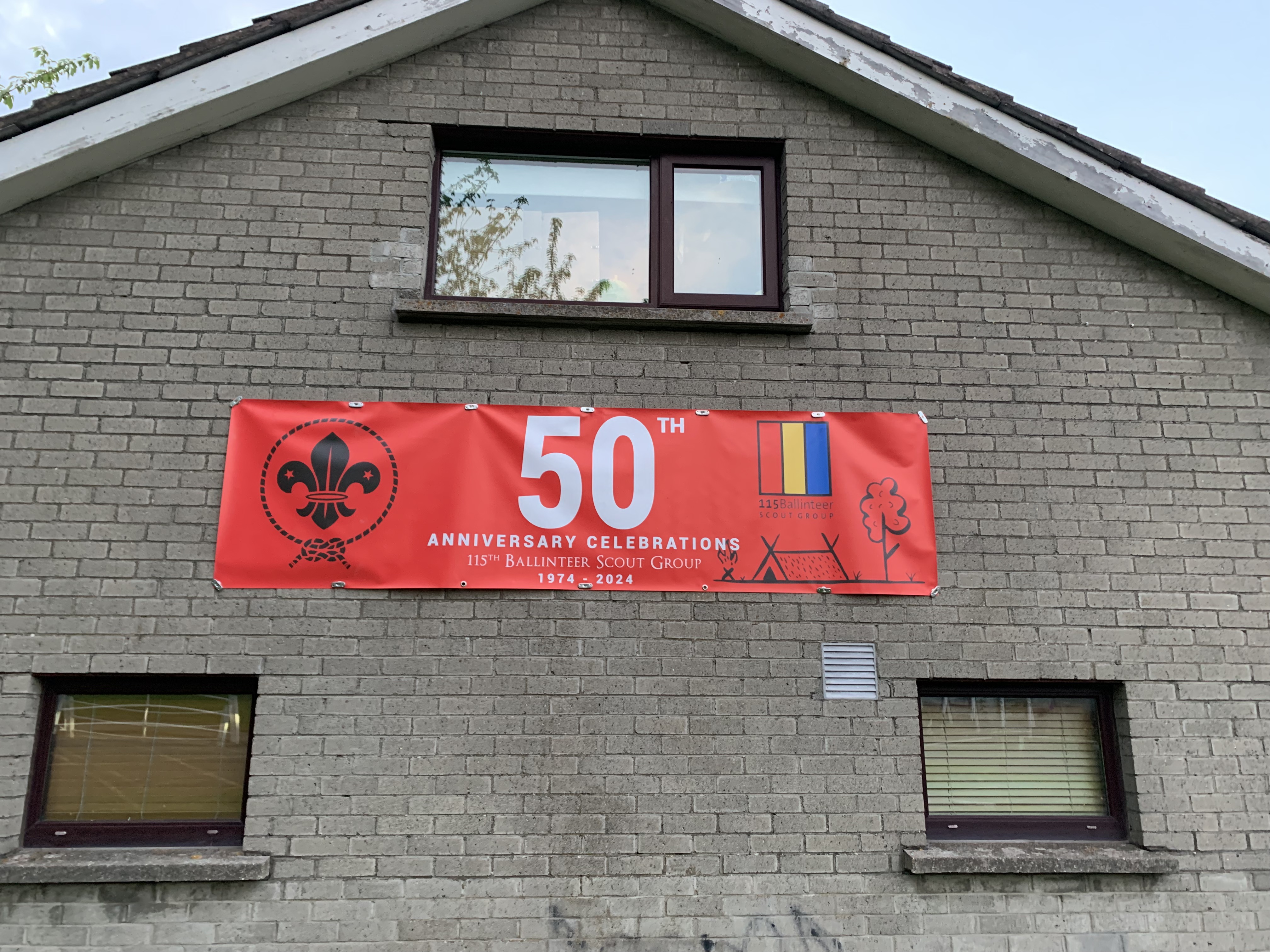 50th anniversary banner on the front of the scout den