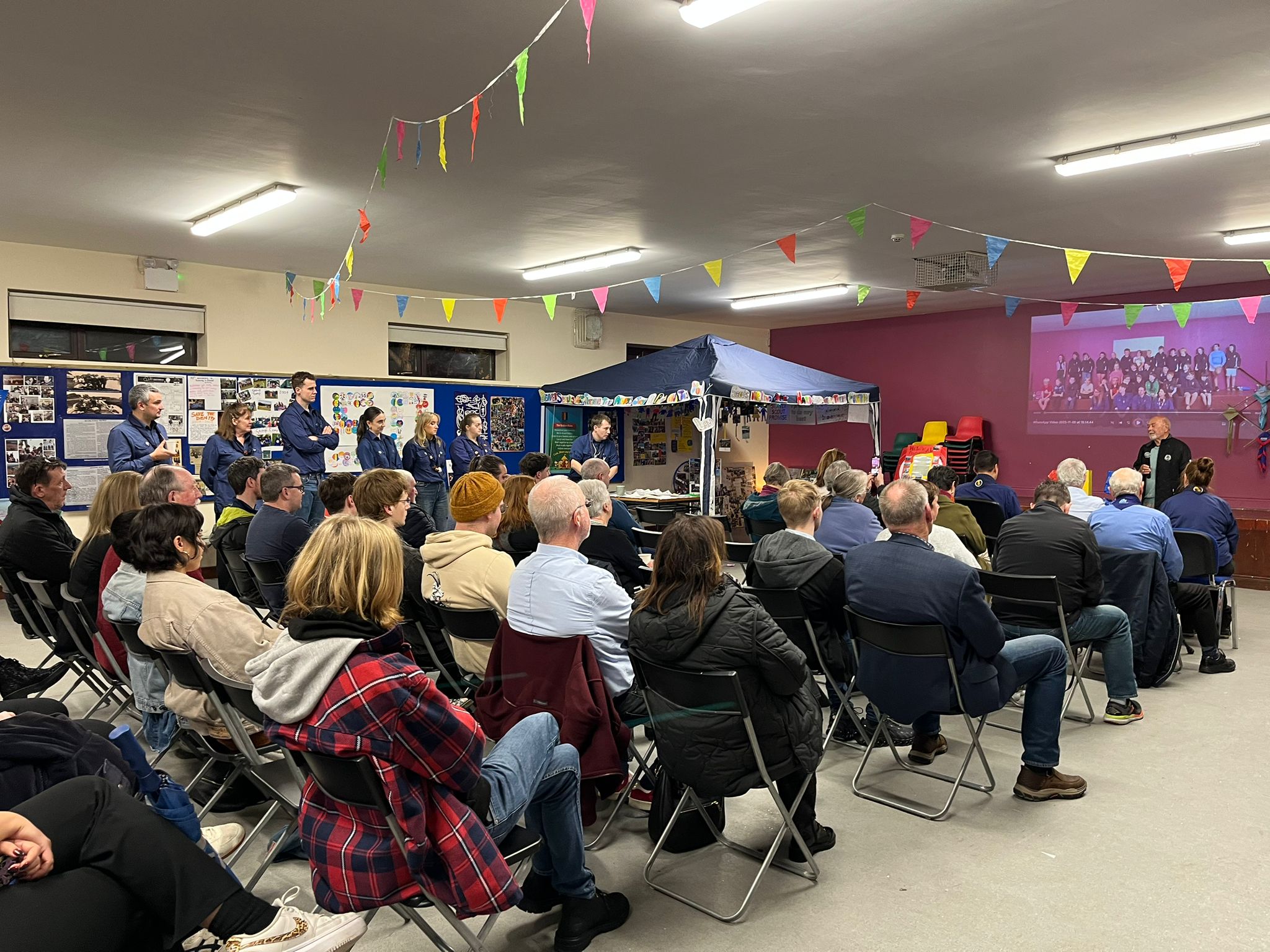 Don Kerrigan, founding leader of 115th Ballinteer, addressing a packed room of past and present members at the Twilight Journeys evening, November 8th 2025